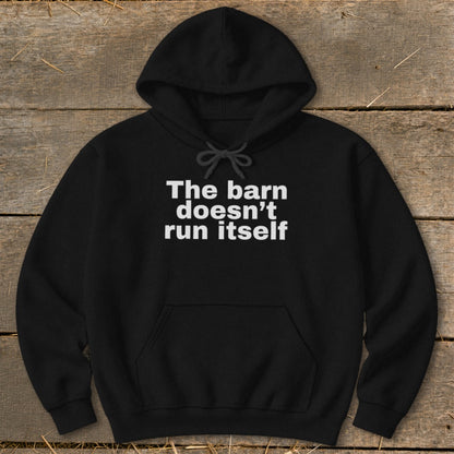 Black hoodie with white text reading "The barn doesn't run itself."