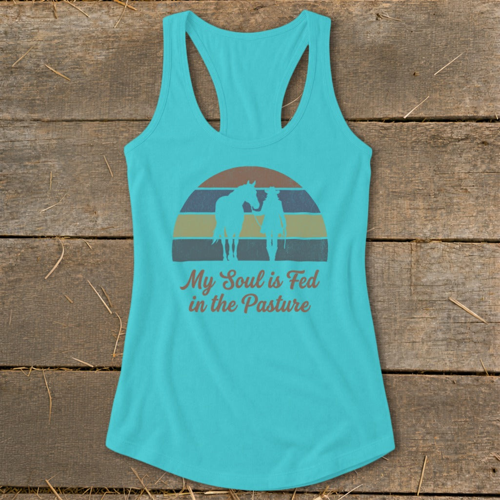 Teal tank top with horse and rider silhouette and text "My Soul is Fed in the Pasture".