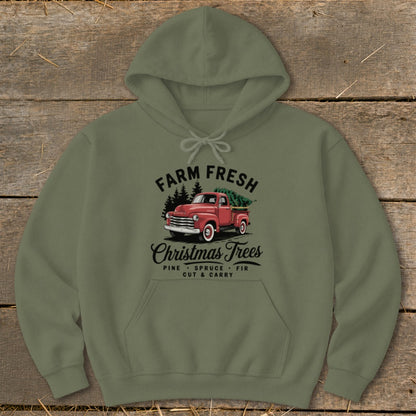 Green hoodie with "Farm Fresh Christmas Trees" graphic featuring a red truck and trees.