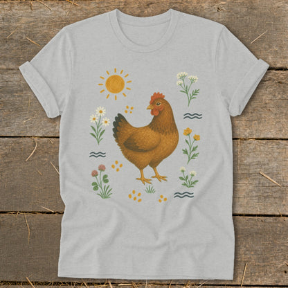Brown chicken surrounded by flowers, sun, and wavy lines on a light gray t-shirt.