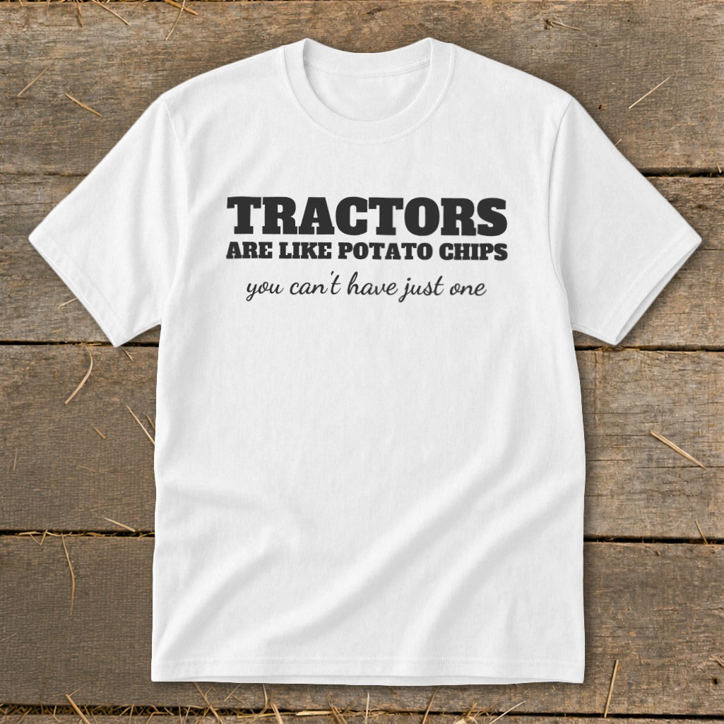White t-shirt with black text that reads "TRACTORS ARE LIKE POTATO CHIPS you can't have just one".