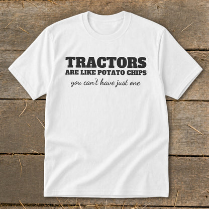 White t-shirt with black text that reads "TRACTORS ARE LIKE POTATO CHIPS you can't have just one".