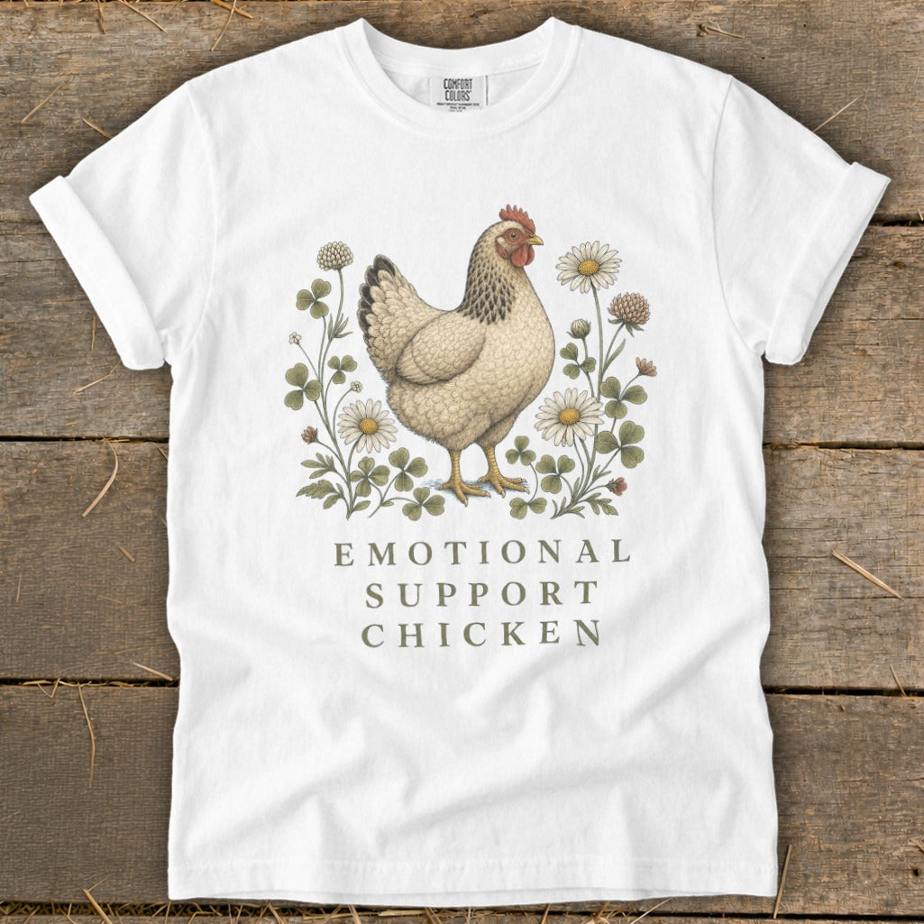 White t-shirt with a chicken illustration and "EMOTIONAL SUPPORT CHICKEN" text.