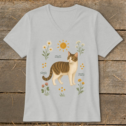 Tabby cat with flowers and sun design on a light gray v-neck t-shirt.