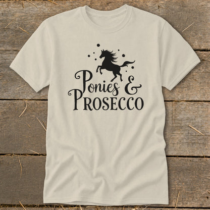 Light-colored t-shirt with black graphic of a prancing horse and text "Ponies & PROSECCO".