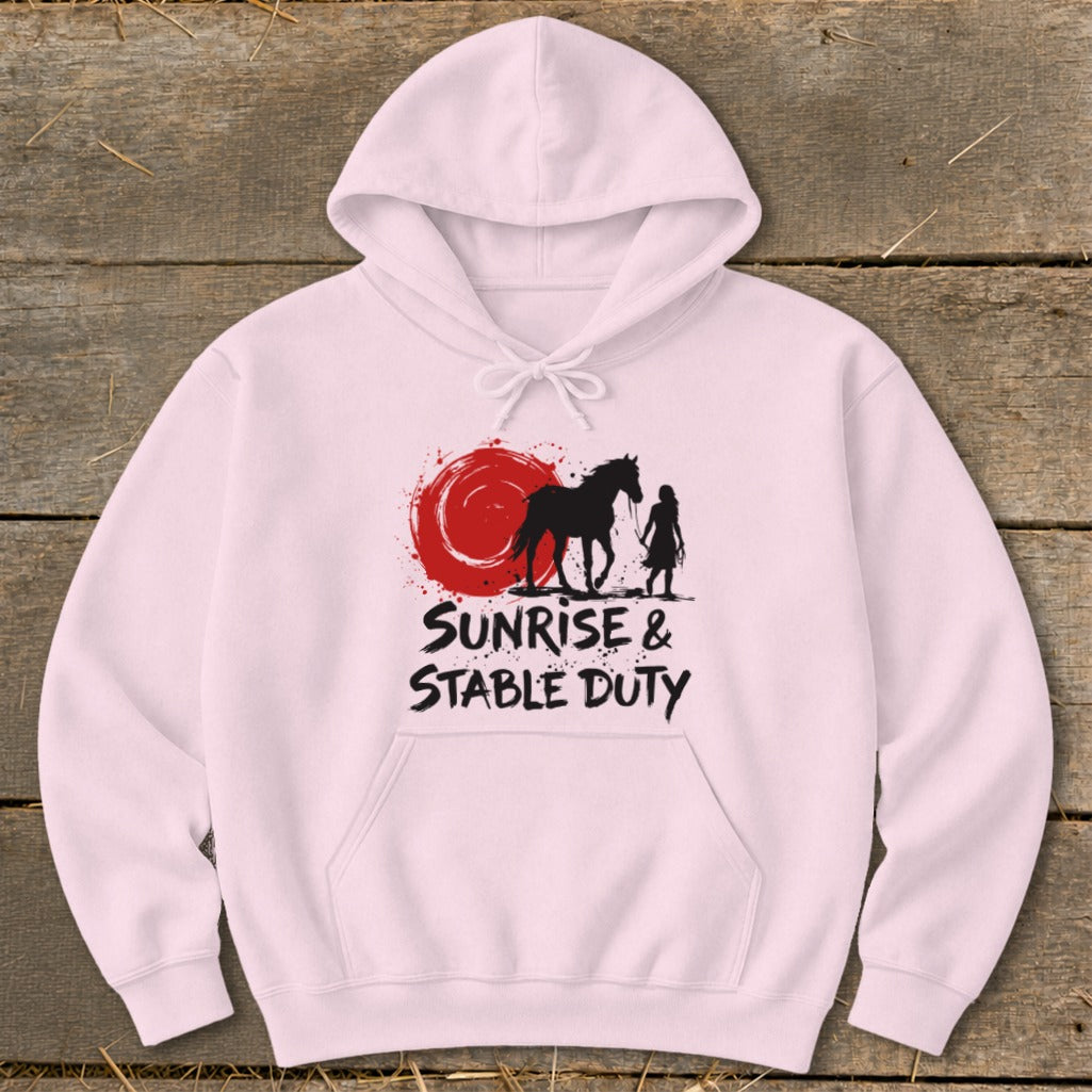 Pink hoodie with black graphic of horse and person, and text "Sunrise & Stable Duty".