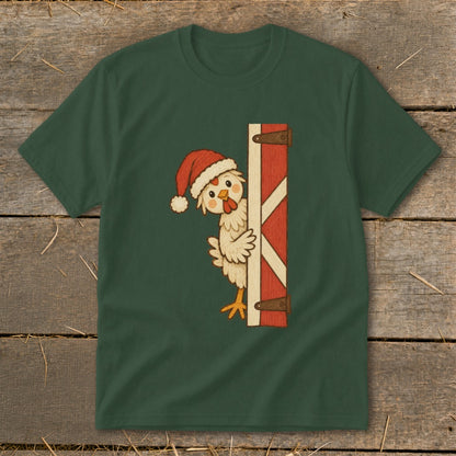 Green t-shirt with cartoon chicken wearing Santa hat peeking behind barn door.