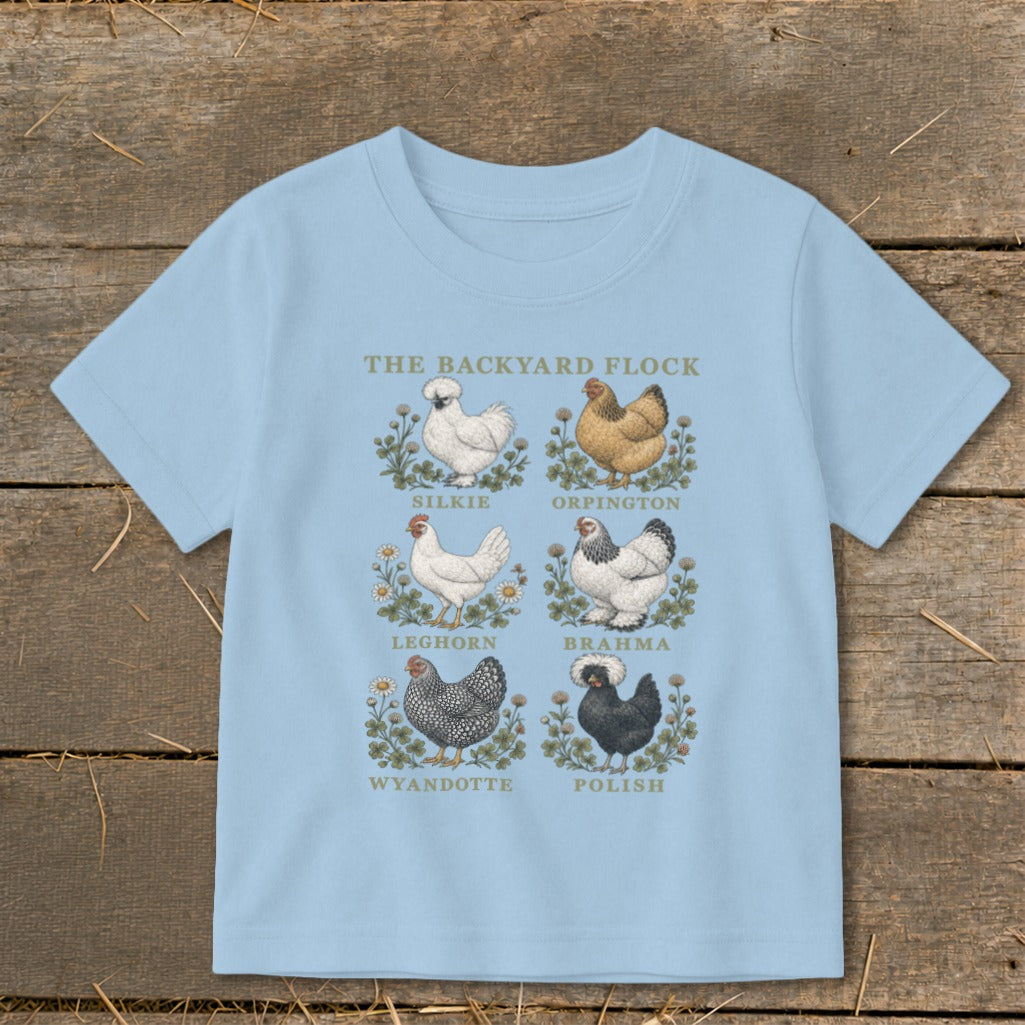 Light blue t-shirt with "The Backyard Flock" and six chicken breeds illustrated.