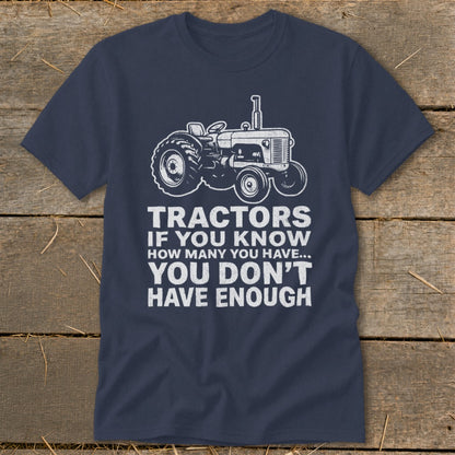 Navy t-shirt with white graphic of a tractor and text: "Tractors if you know how many you have... You don't have enough."