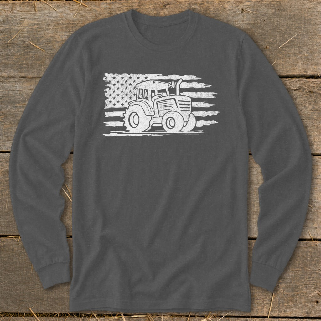 Tractor graphic on distressed American flag on dark grey long sleeve shirt.