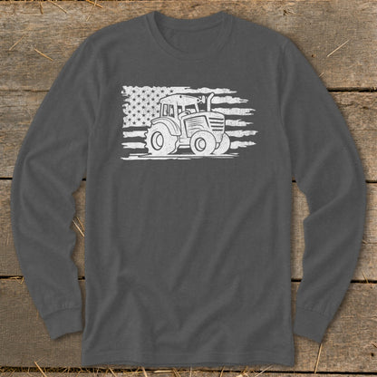 Tractor graphic on distressed American flag on dark grey long sleeve shirt.