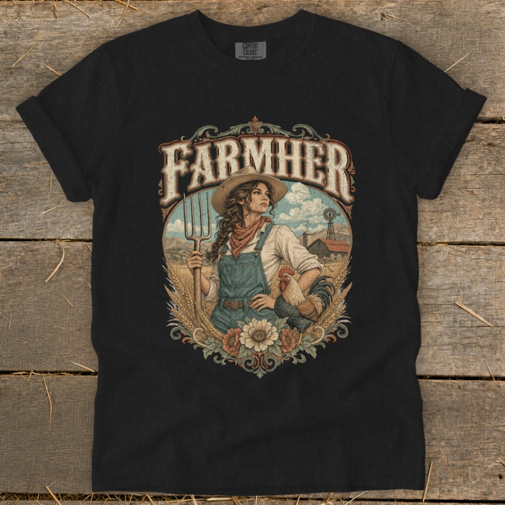 Black t-shirt with FarmHer graphic of a woman with pitchfork and rooster on farm.