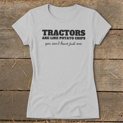 Light grey t-shirt with "Tractors are like potato chips, you can't have just one."