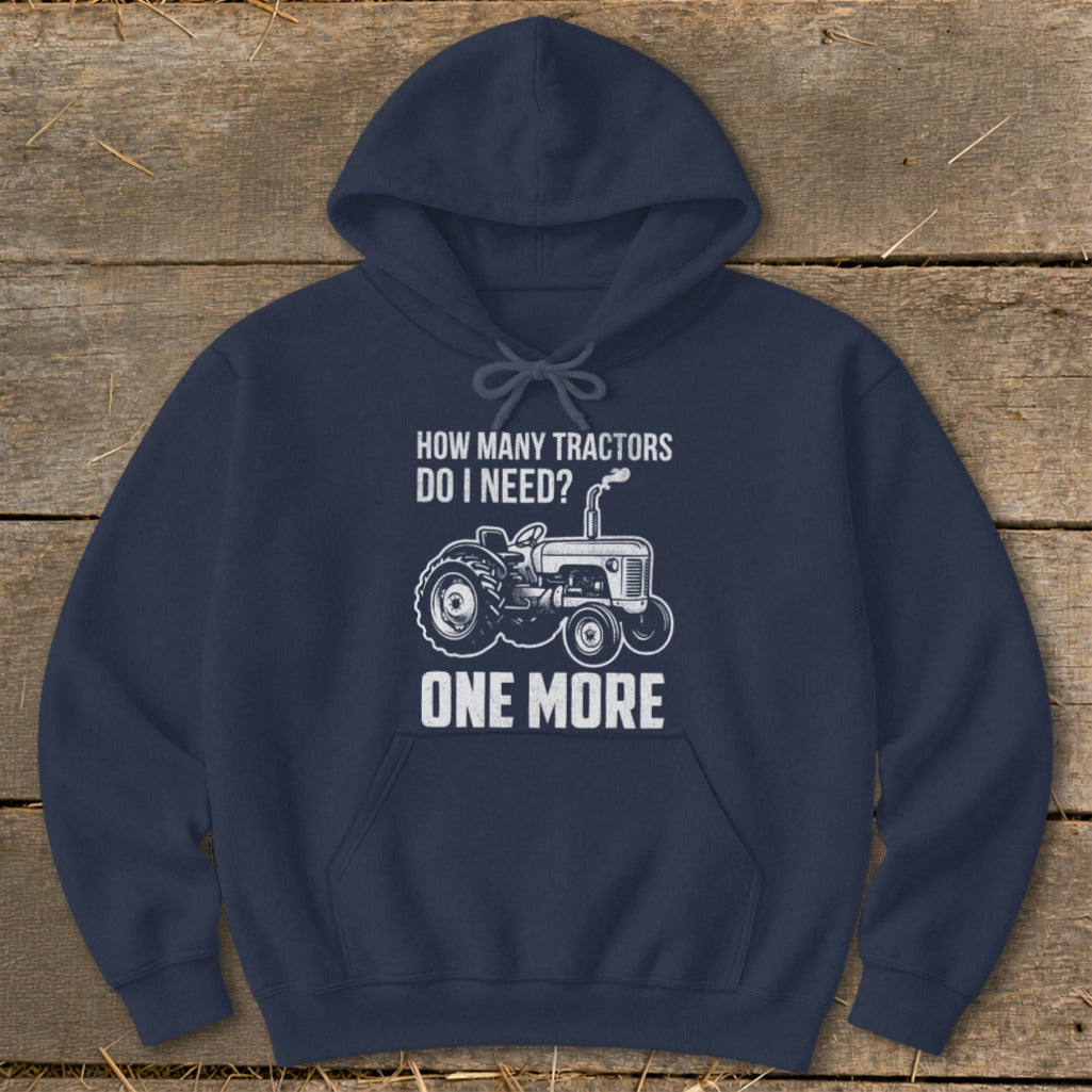 Navy hoodie with "How Many Tractors Do I Need? One More" text and tractor graphic.