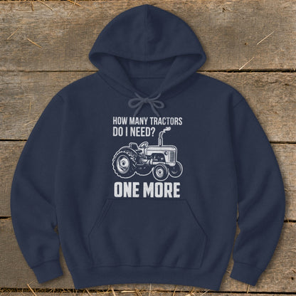 Navy hoodie with "How Many Tractors Do I Need? One More" text and tractor graphic.