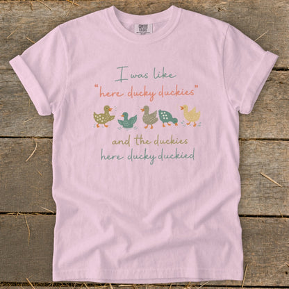 Comfort Colors light pink t-shirt with ducks and text "I was like 'here ducky duckies' and the duckies here ducky duckied".