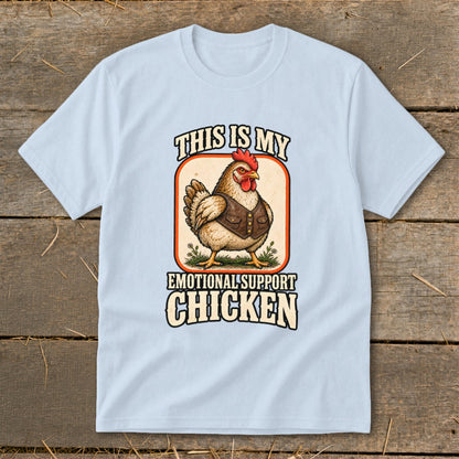 Light blue t-shirt graphic with a chicken wearing a vest, text reads "This is my emotional support chicken."