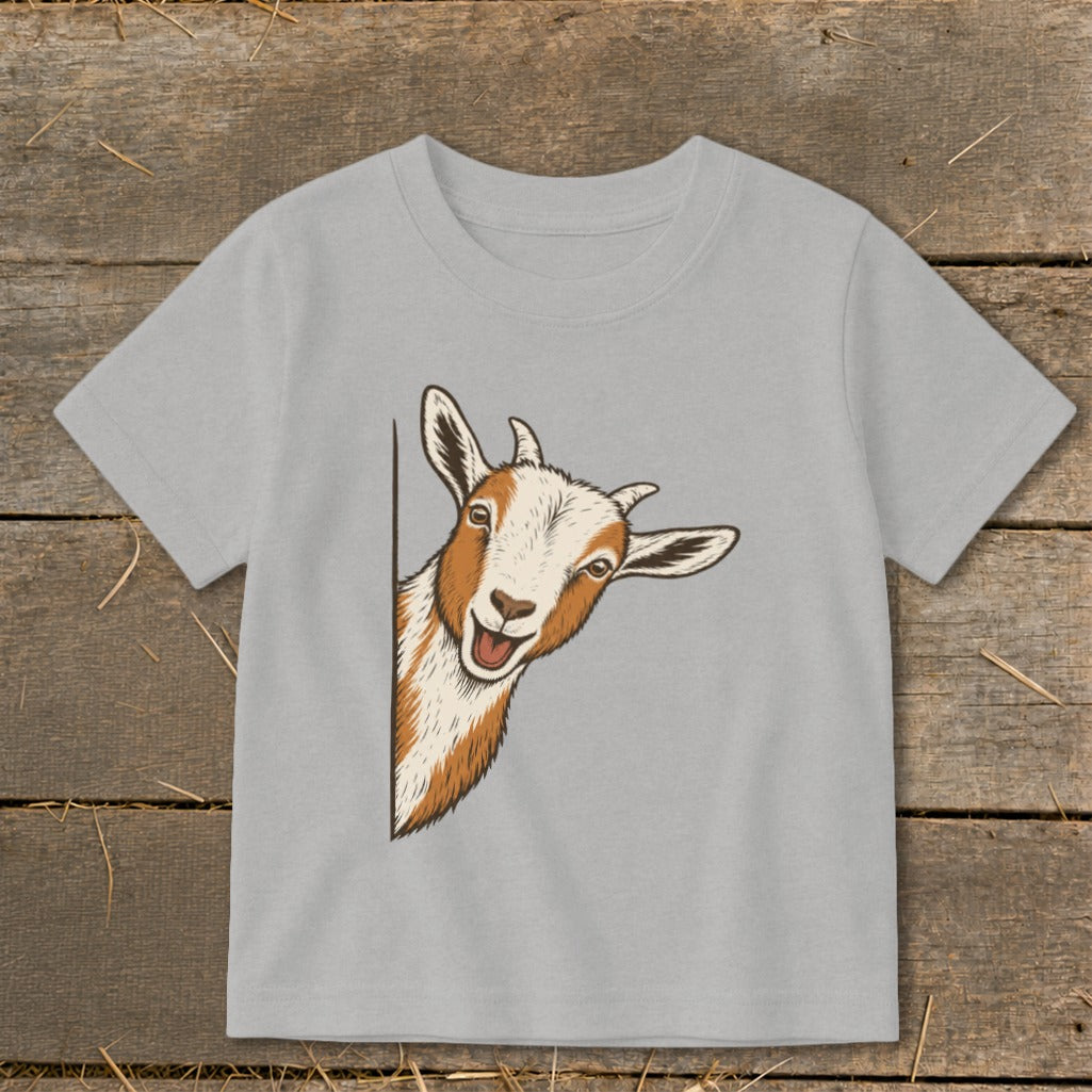 Light grey t-shirt with a cartoon goat peeking from behind a corner.