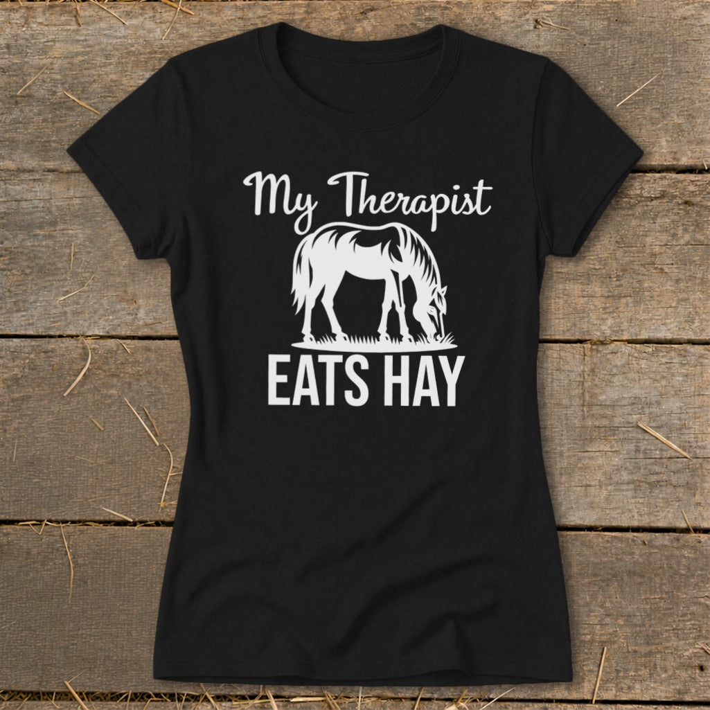 Black t-shirt with white text and horse graphic: My Therapist Eats Hay