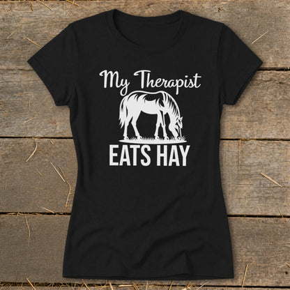 Black t-shirt with white text and horse graphic: My Therapist Eats Hay