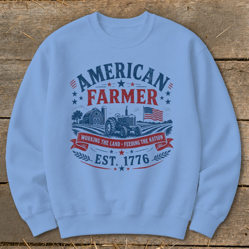 Light blue sweatshirt with "American Farmer" graphic, tractor, barn, and American flag.