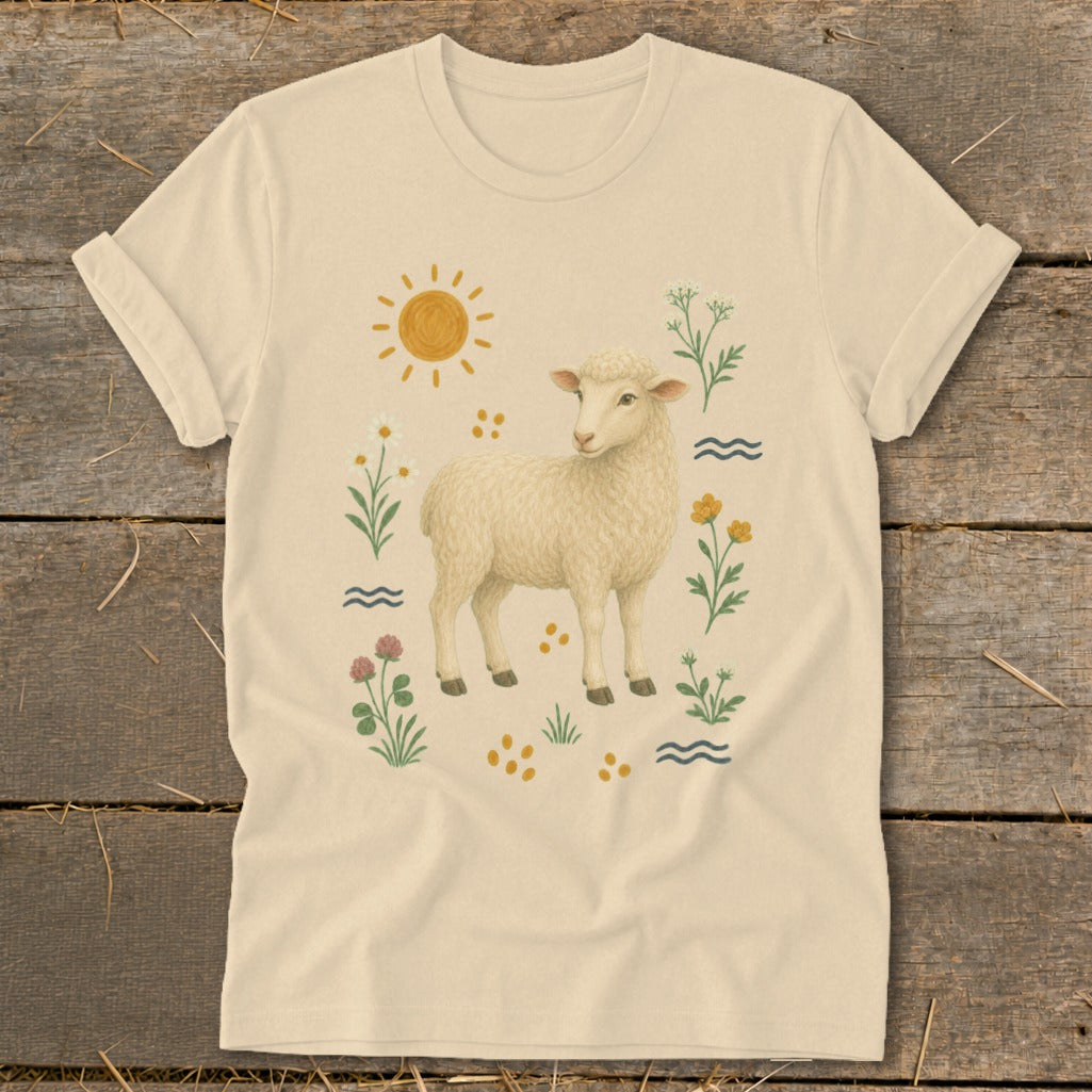 Cream t-shirt with a sheep illustration surrounded by flowers, sun, and waves.