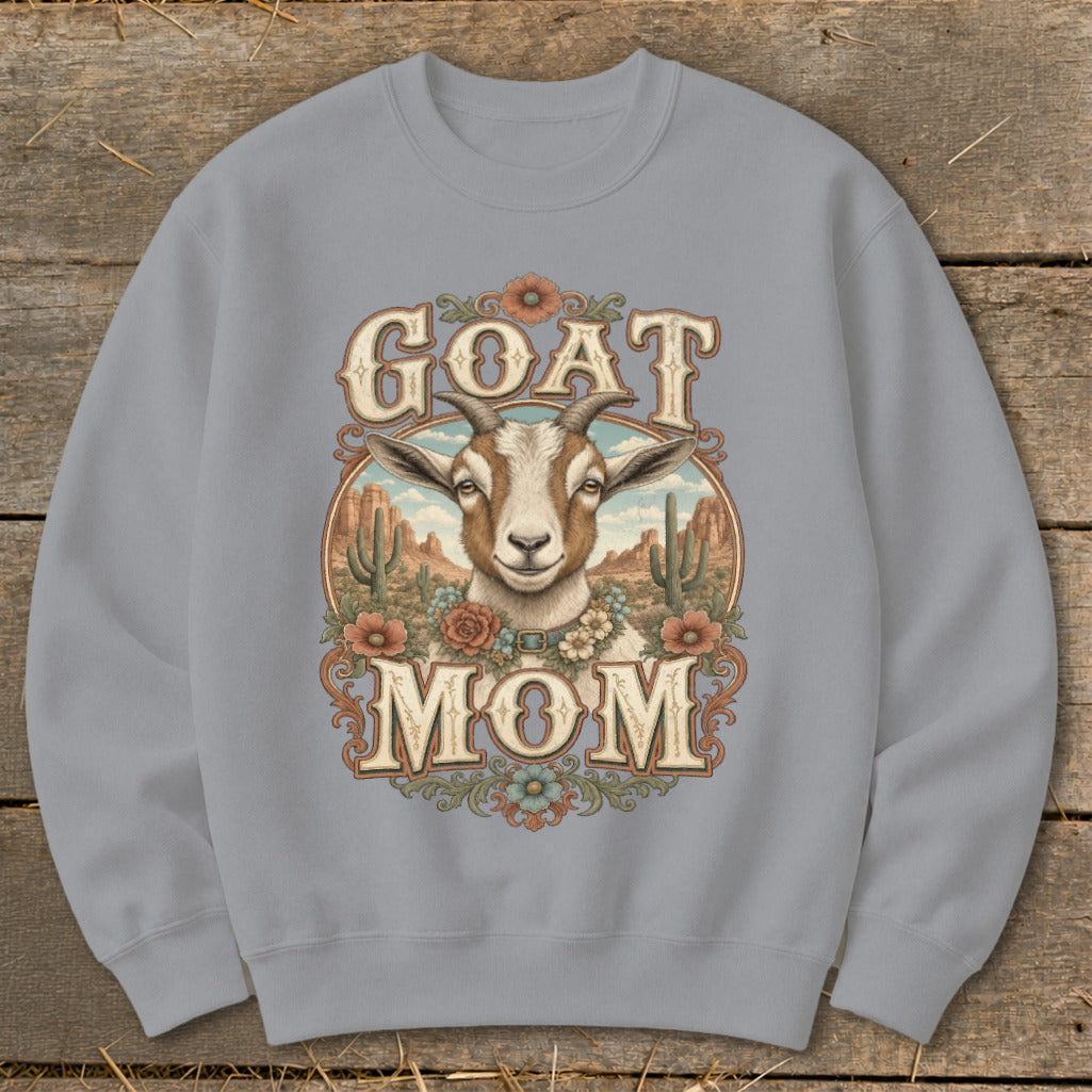 Grey sweatshirt with "GOAT MOM" text and a goat in a desert landscape.