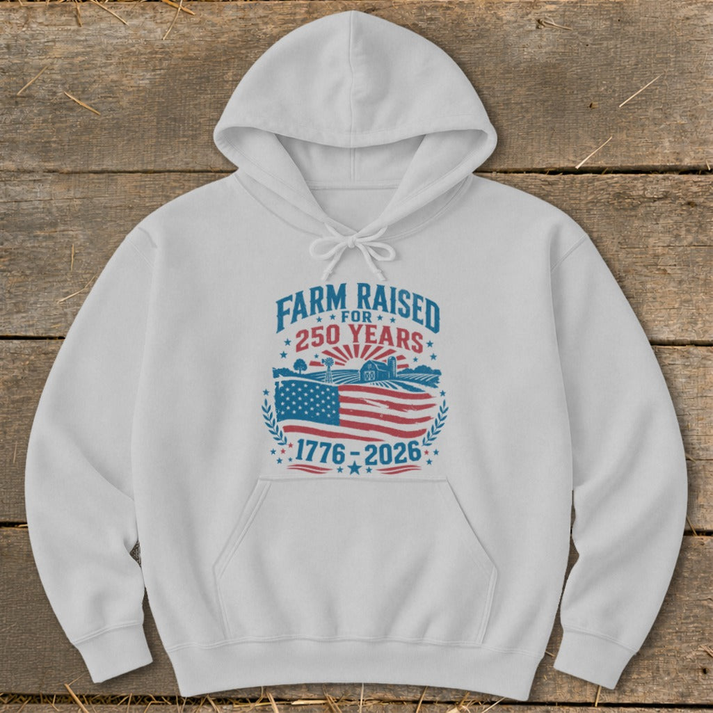 White hoodie with graphic "Farm Raised for 250 Years 1776-2026".