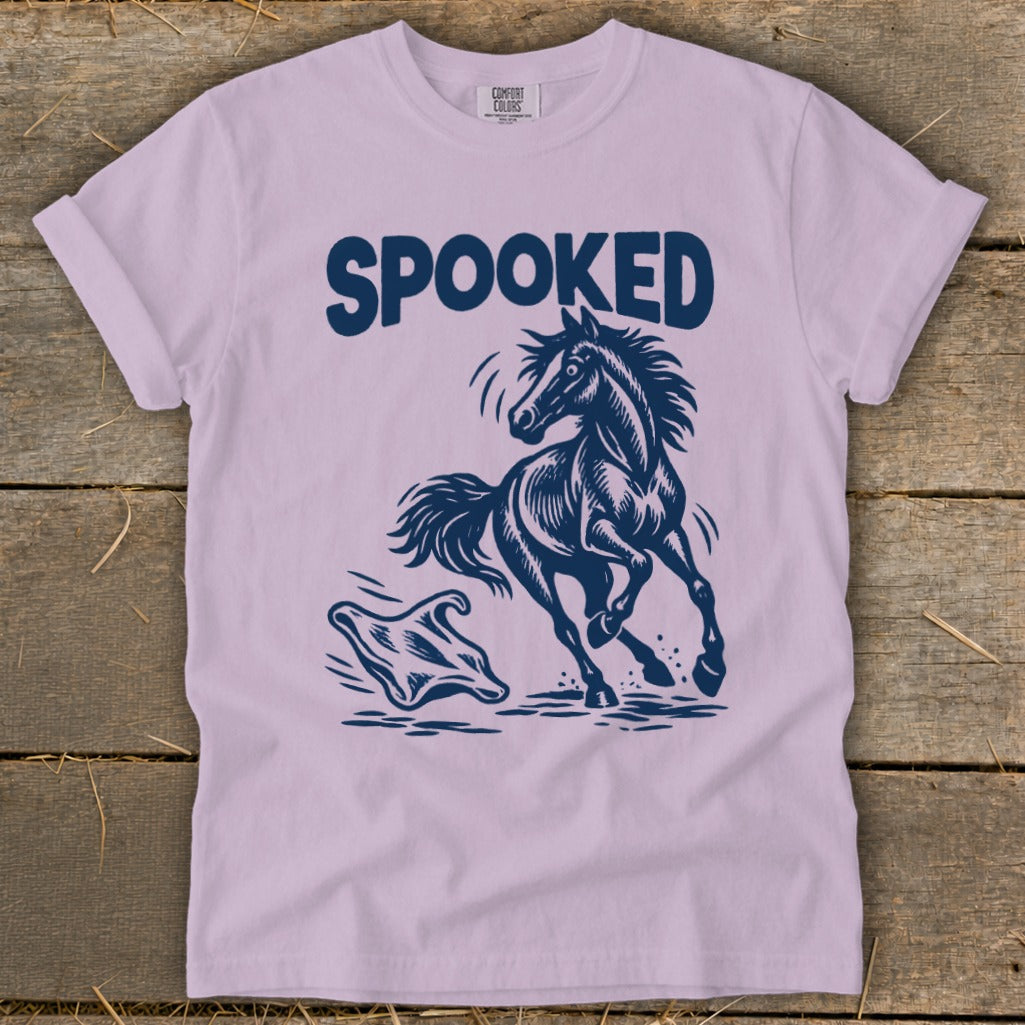 Light purple t-shirt with "SPOOKED" text above a startled horse facing a ghost.