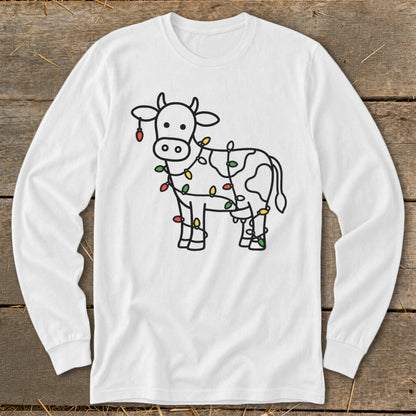 White long-sleeve shirt with a black outline drawing of a cow decorated with colorful Christmas lights.