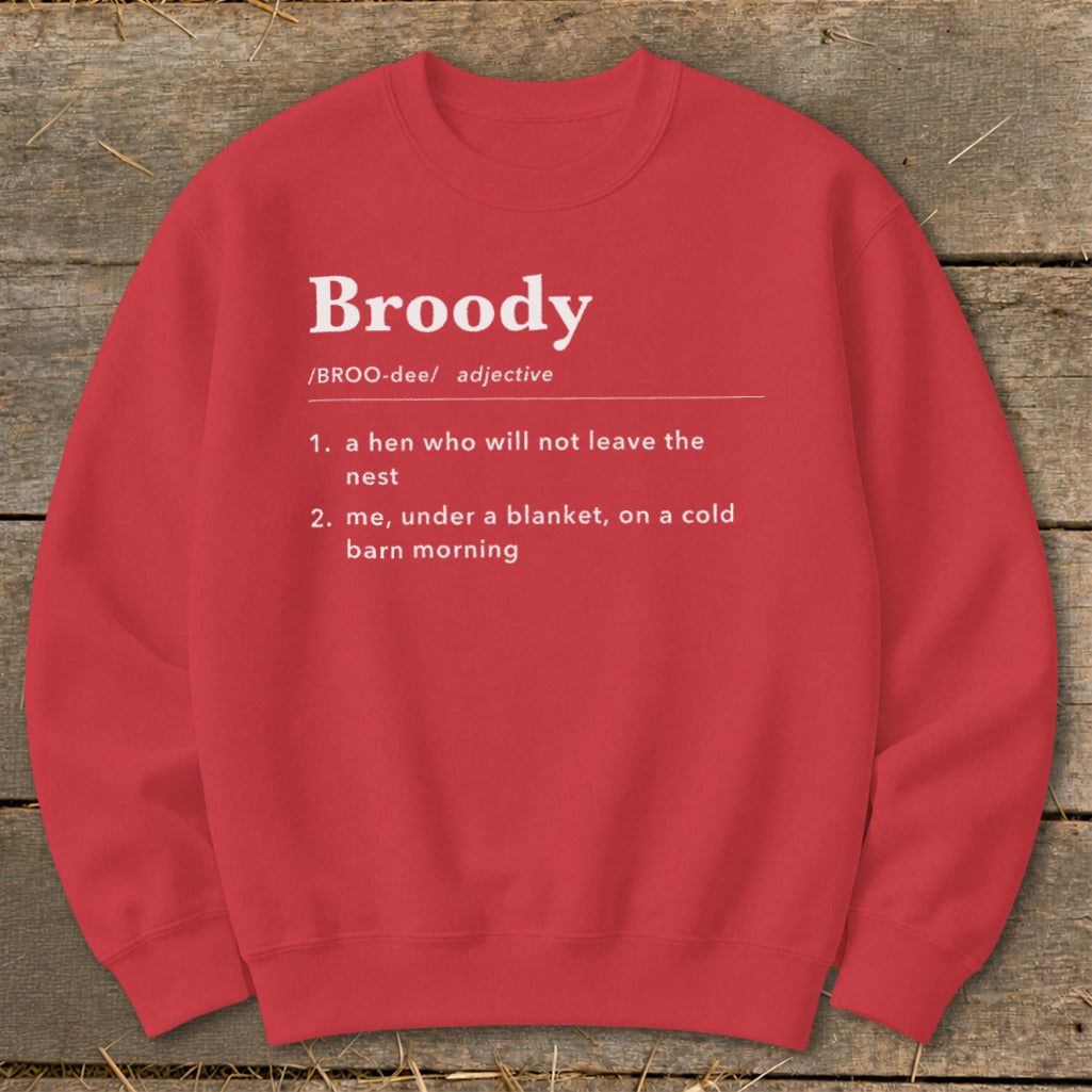 Red sweatshirt with "Broody" definition: hen not leaving nest, or me under blanket.