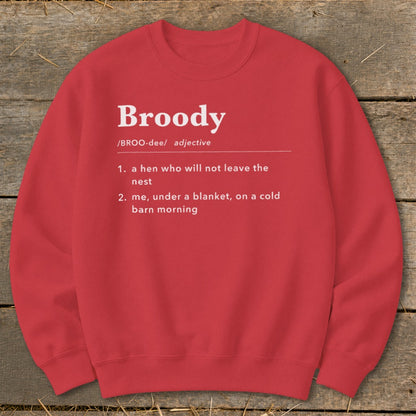 Red sweatshirt with "Broody" definition: hen not leaving nest, or me under blanket.