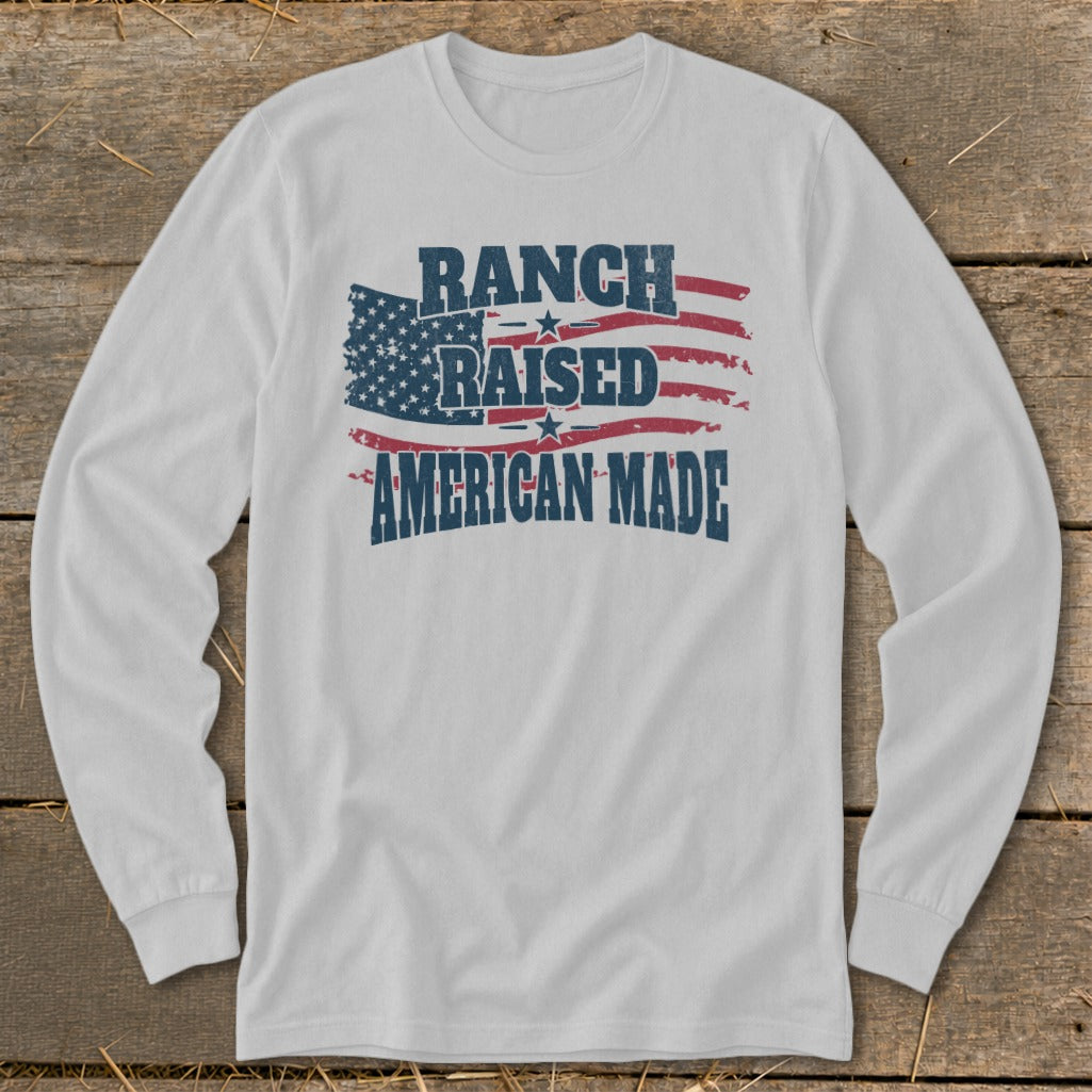 White long sleeve shirt with "Ranch Raised American Made" and American flag graphic.