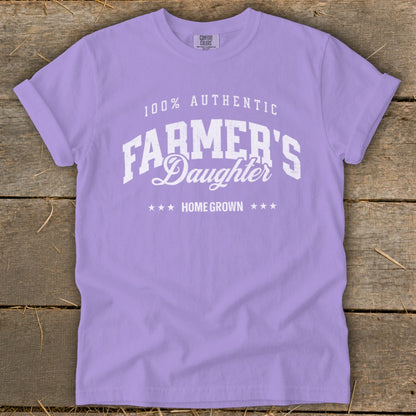 Purple t-shirt with white text "100% AUTHENTIC FARMER'S Daughter HOME GROWN".