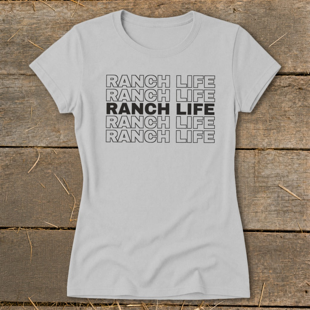 A light gray crewneck t-shirt with the text RANCH LIFE printed in stacked rows.