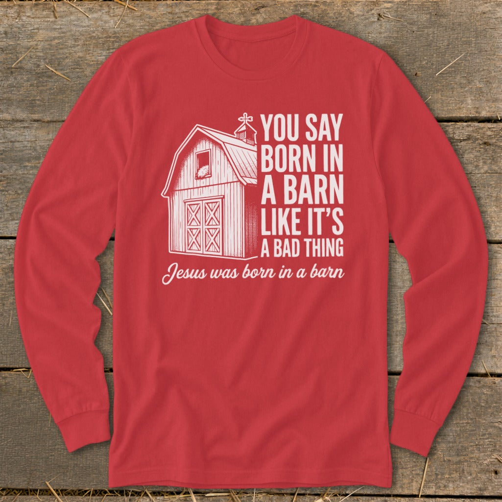 Red long-sleeve shirt with barn graphic and "You say born in a barn like it's a bad thing" text.