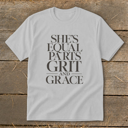 Light gray t-shirt with text "SHE'S EQUAL PARTS GRIT AND GRACE".