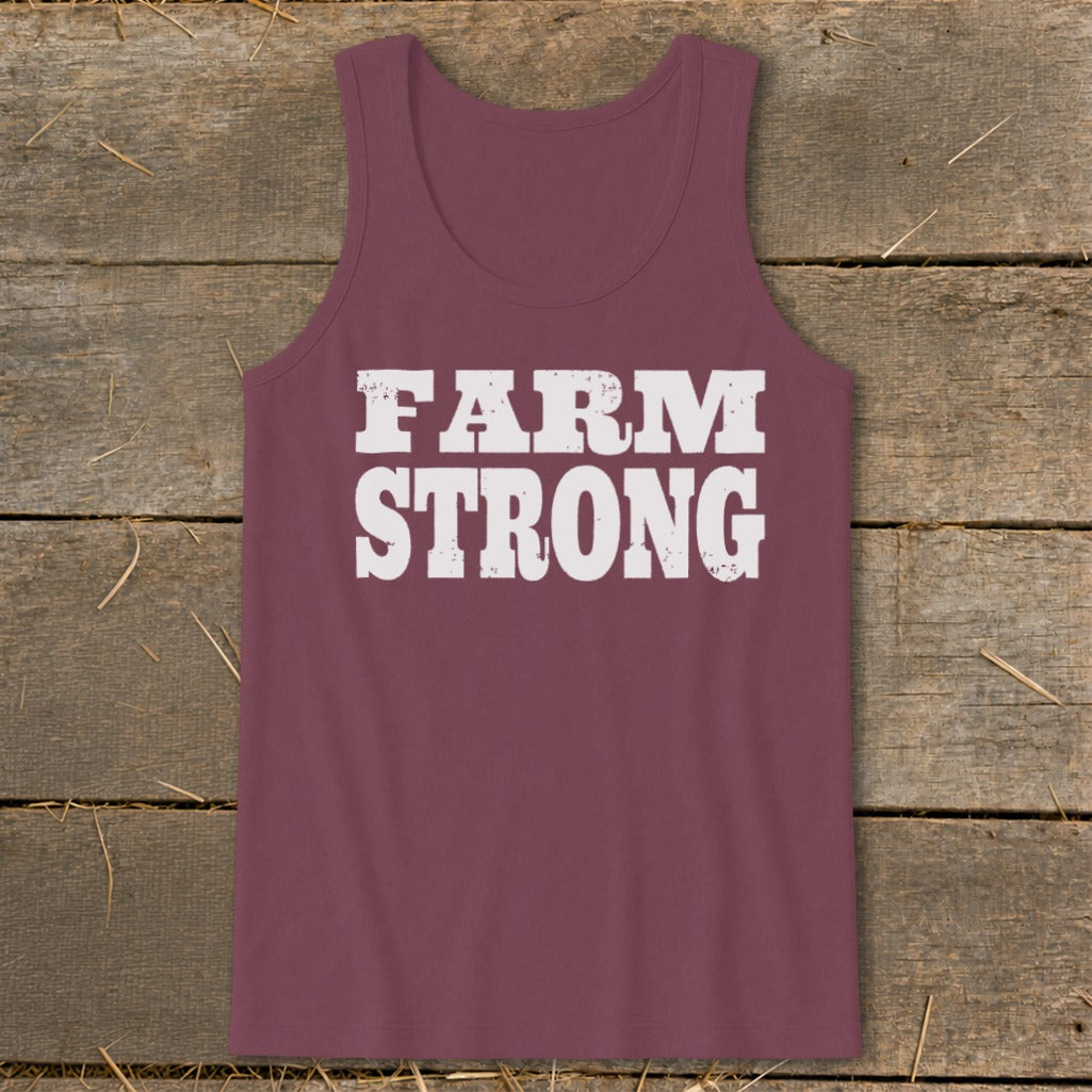 Maroon women's tank top with the white distressed text Farm Strong printed on the chest.