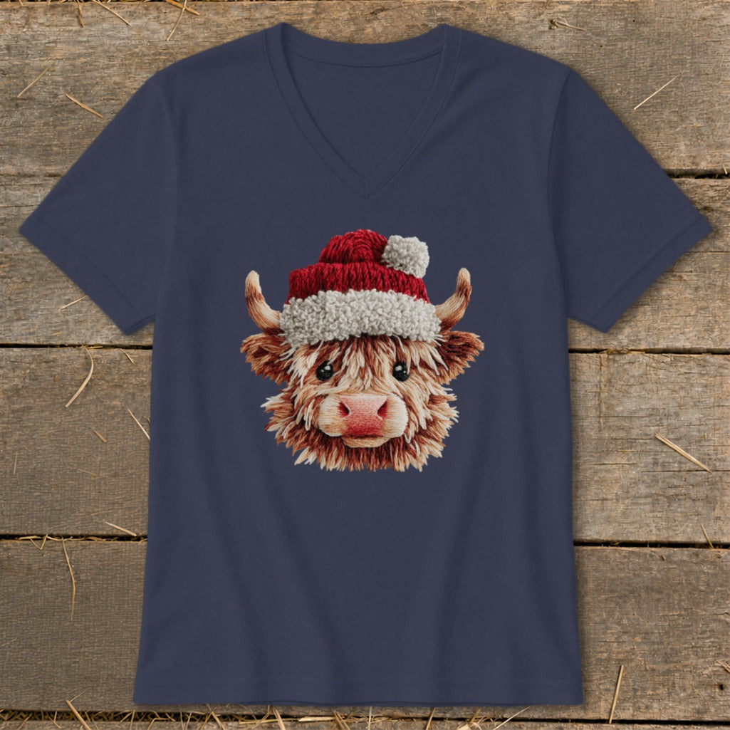 Navy v-neck t-shirt with a humorous Highland cow graphic wearing a Santa hat.