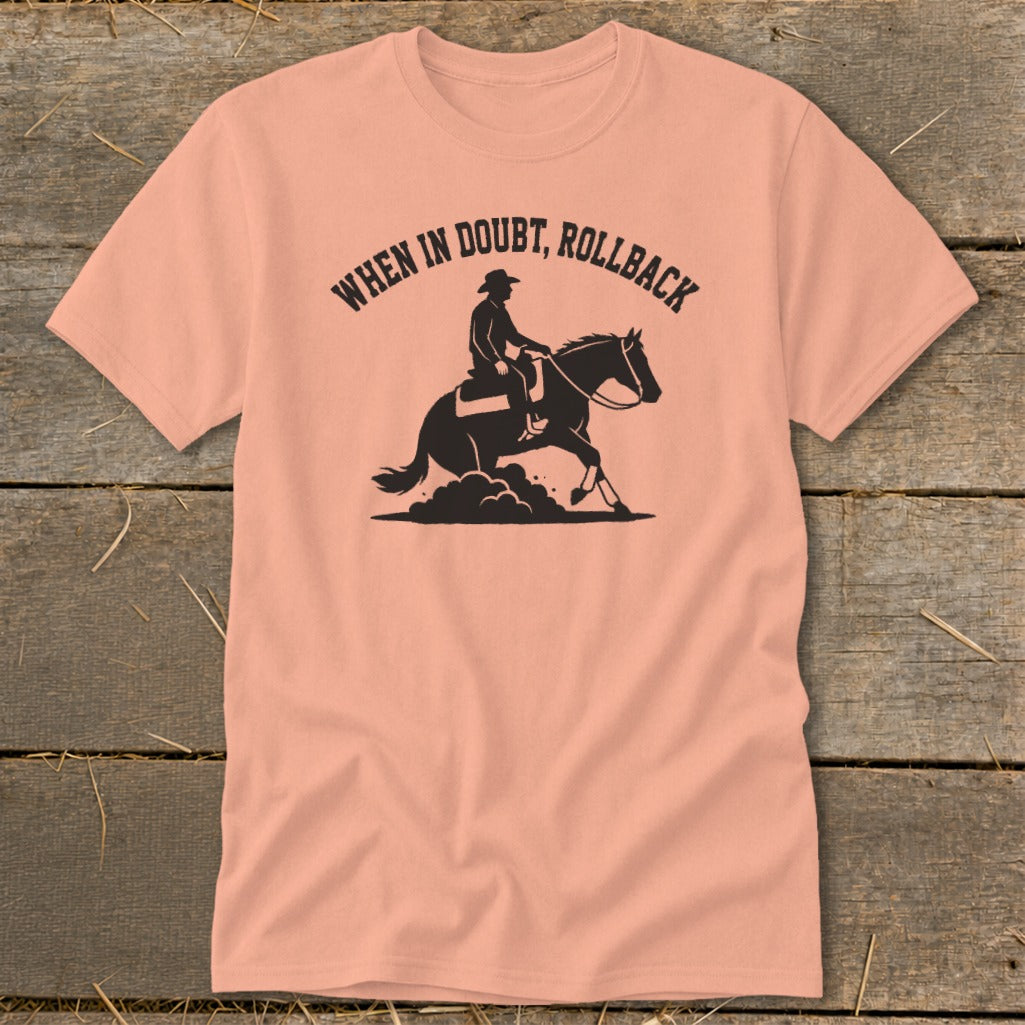 Peach t-shirt with black graphic of cowboy on horse and text "When In Doubt, Rollback".