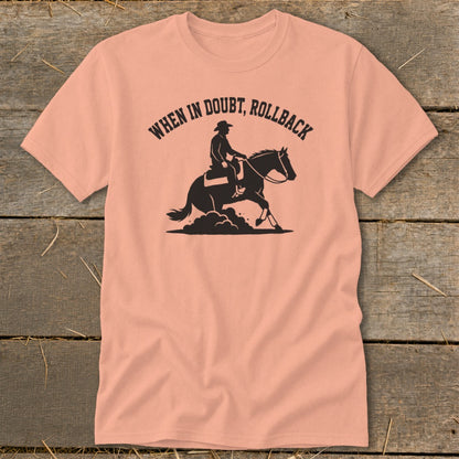 Peach t-shirt with black graphic of cowboy on horse and text "When In Doubt, Rollback".