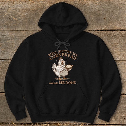 Black hoodie with a chicken holding cornbread and text "Well Butter My Cornbread and Call Me Done."