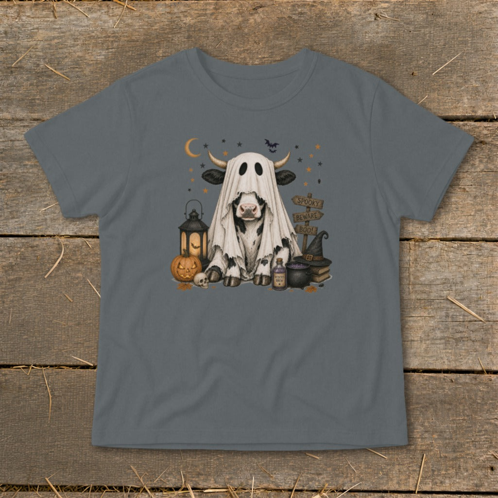 Cow dressed as a ghost with Halloween decorations and "Spooky Beware Boo!" signs.