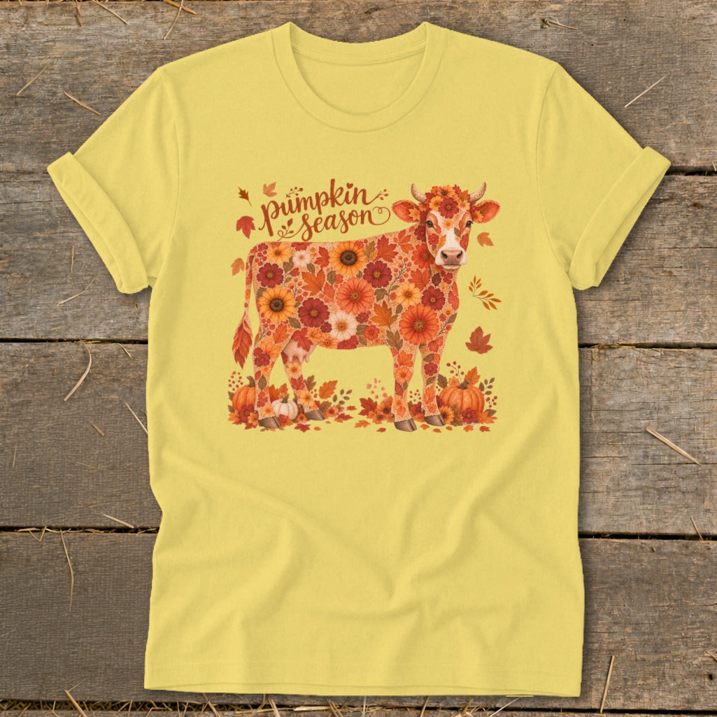 Yellow t-shirt with cow art made of autumn flowers and pumpkins, "Pumpkin Season" text.