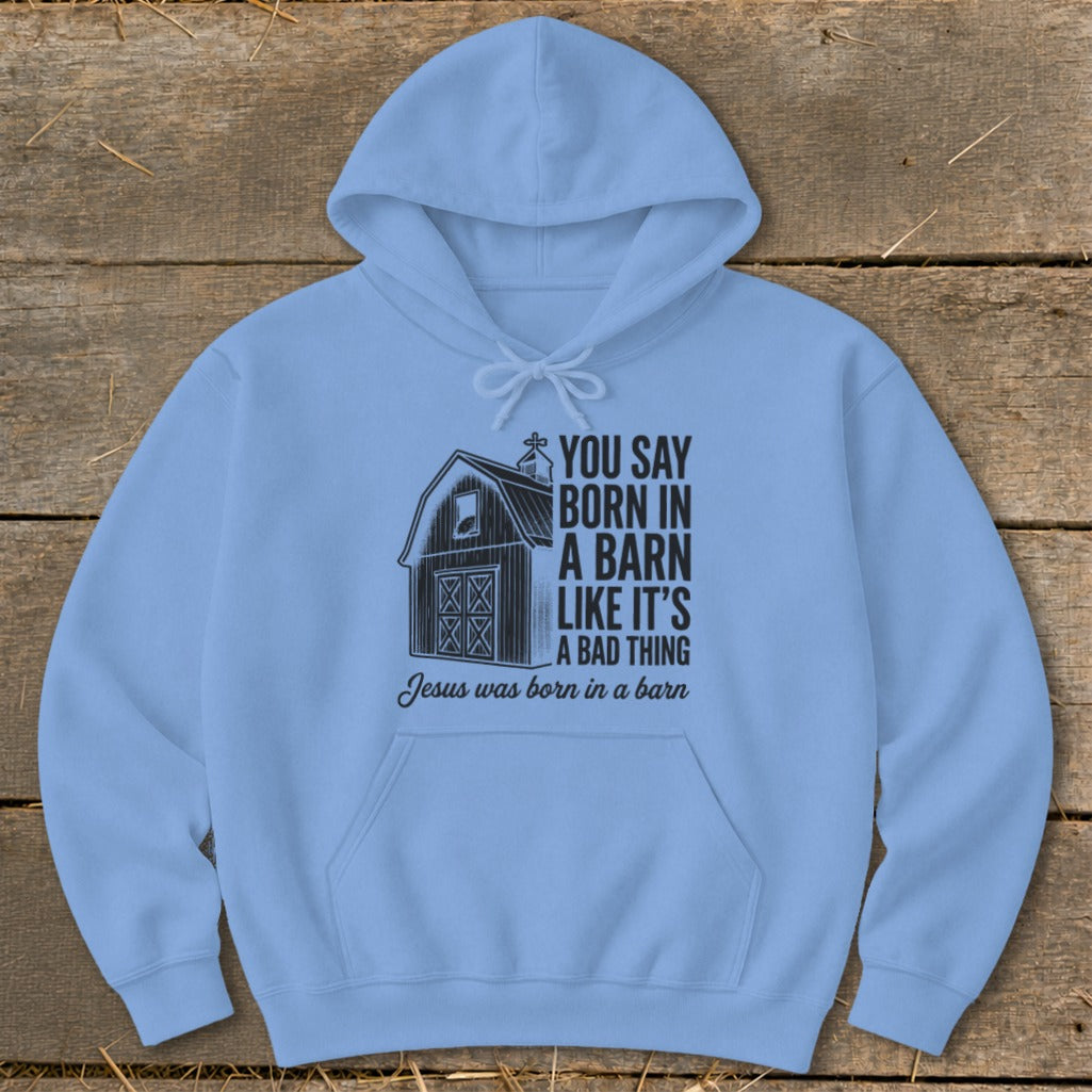Light blue hoodie with barn graphic and text "You say born in a barn like it's a bad thing. Jesus was born in a barn."