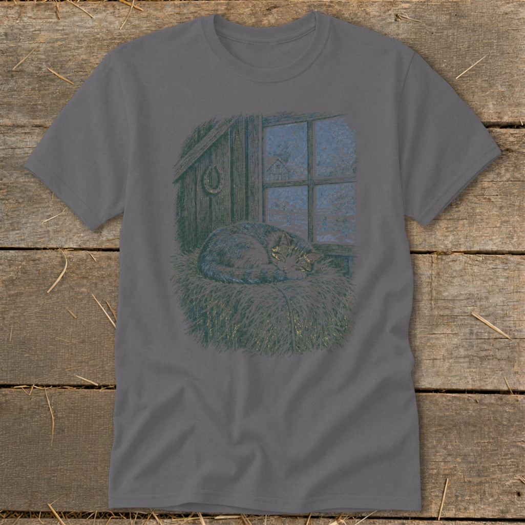 Gray t-shirt with a sleeping cat in straw by a barn window.