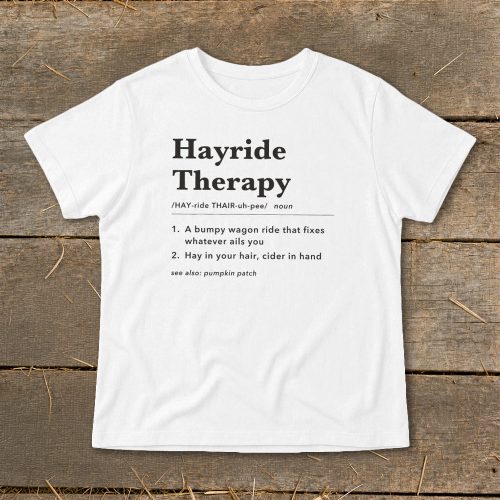 White t-shirt with "Hayride Therapy" definition printed in black text.
