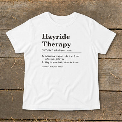 White t-shirt with "Hayride Therapy" definition printed in black text.
