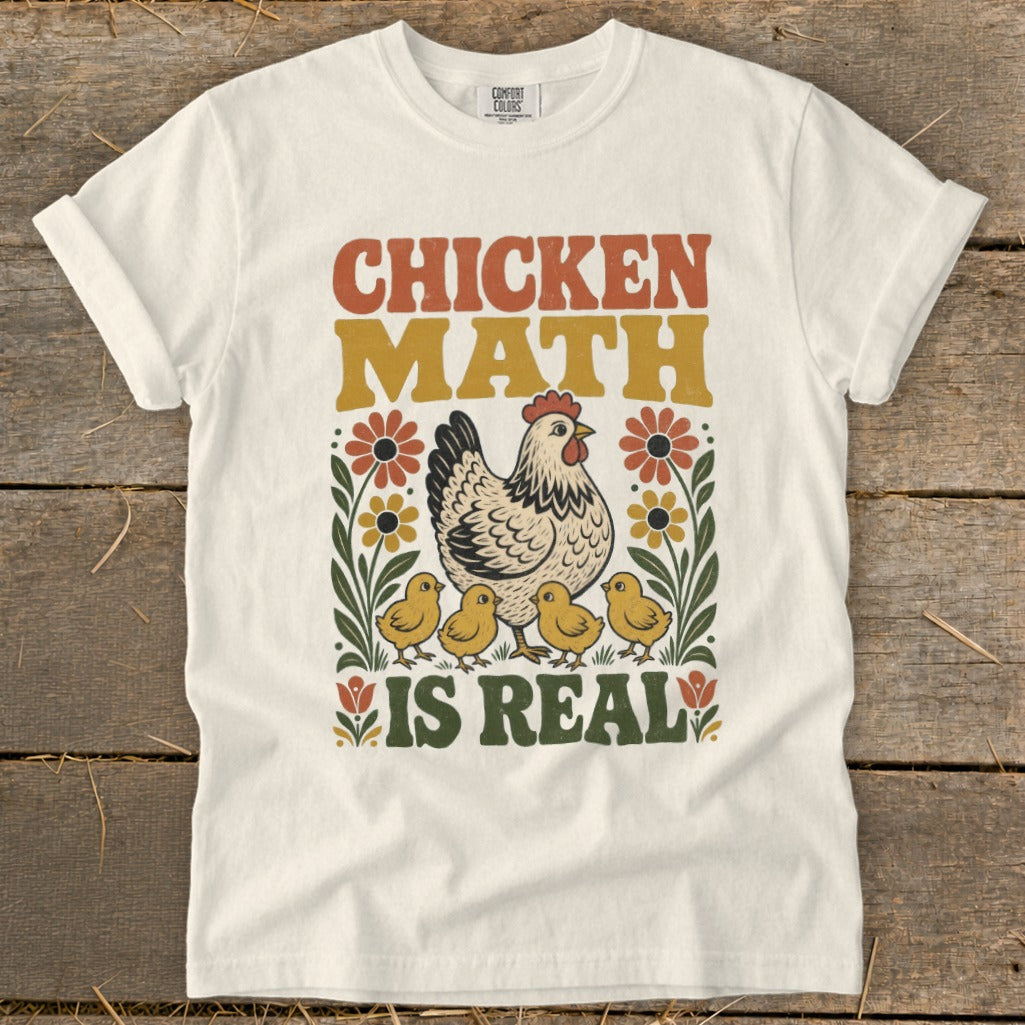 White t-shirt with retro "Chicken Math Is Real" graphic featuring a hen and chicks.