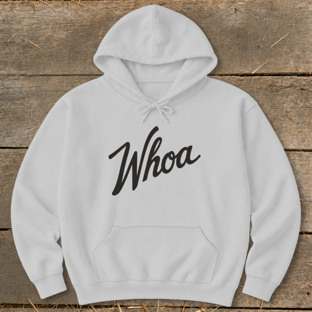 White hoodie with "Whoa" in black cursive text across the chest.